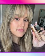 editor holding up the urban decay quickies concealer and ysl concealer