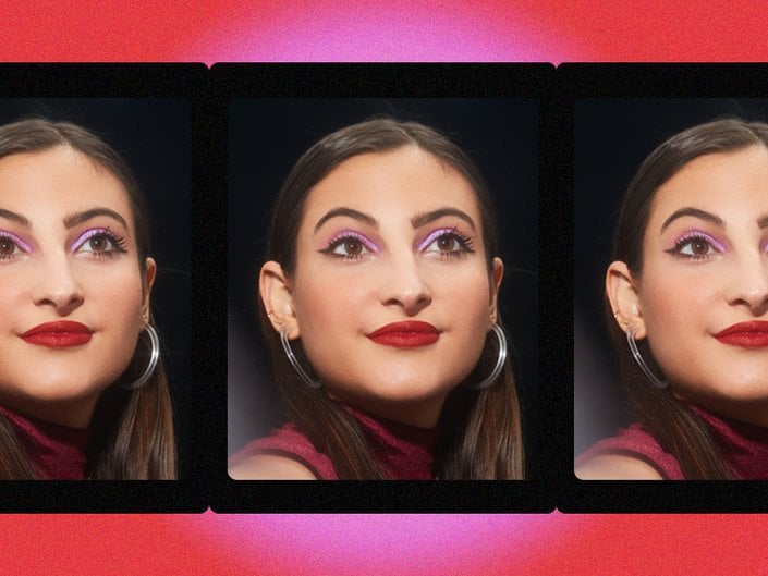 person wearing pink eyeshadow and red lipstick