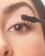Person applying mascara