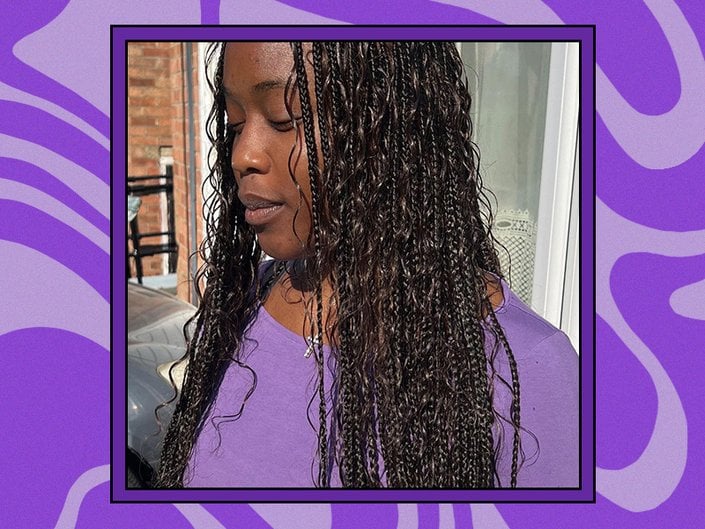 Picture of a person with goddess braids looking down and wearing a purple shirt against a graphic purple background