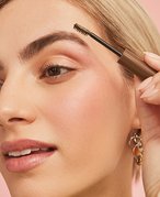 Picture of someone applying eyebrow gel