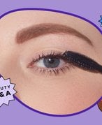 Picture of a person holding mascara wand to eye on a graphic purple background