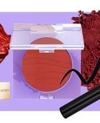 Picture of a mascara tube and mascara swatched on a purple background