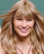 A woman with blonde hair with bangs