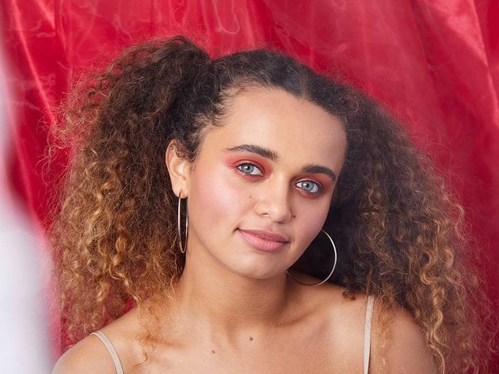 person wearing red smokey eyeshadow