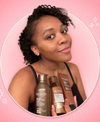 kat holding the new redken soft curls line