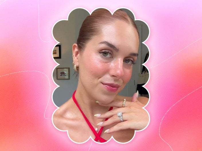 Picture of a red-haired person wearing strawberry girl makeup on a pink gradient graphic background 