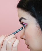 A person using tightline eyeliner